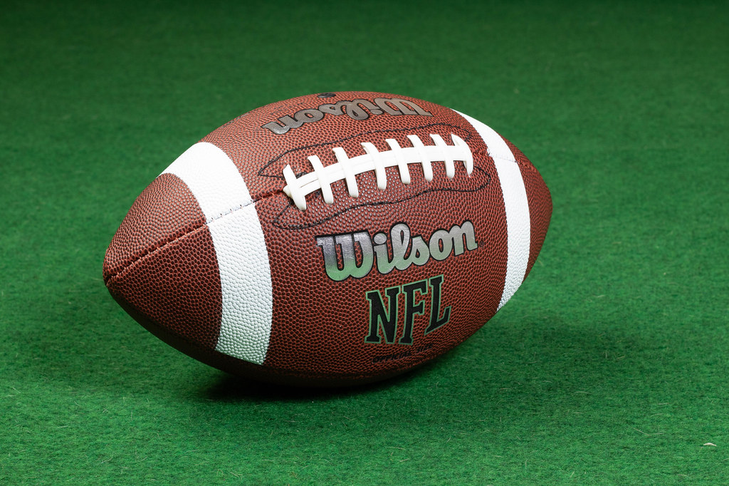 Wilson NFL football on green turf representing football watch parties and sports events at Ed's Tavern Parrish